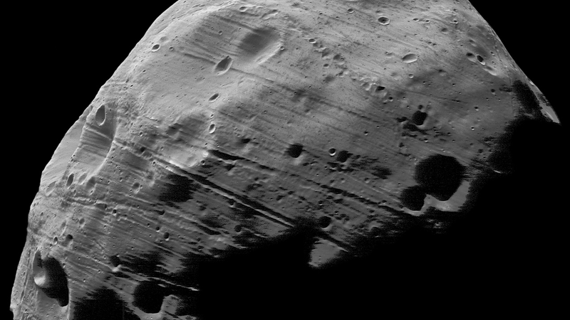 Illustration for article titled One of Mars' Moons Is Literally Pulling Itself to Pieces